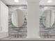 Stylish bathroom vanity with dual sinks and modern fixtures at 642 Erin Way, Brooksville, FL 34601