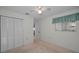 Bedroom with carpet, ceiling fan, and standard closet at 6425 Thicket Trl, New Port Richey, FL 34653