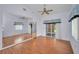 A spacious bedroom with lots of natural light and mirrored closet doors at 6425 Thicket Trl, New Port Richey, FL 34653