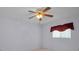 Bedroom showcasing a ceiling fan, neutral carpet, and a window adorned with a valance at 6425 Thicket Trl, New Port Richey, FL 34653
