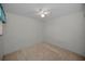 Bright bedroom with a ceiling fan and neutral carpeting at 6425 Thicket Trl, New Port Richey, FL 34653