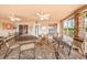 Covered community patio features a ceiling fan, exterior lighting, brick columns and plenty of seating at 6425 Thicket Trl, New Port Richey, FL 34653