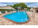 A sparkling community pool with plenty of lounge chairs for residents to enjoy at 6425 Thicket Trl, New Port Richey, FL 34653