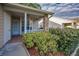 Charming front porch with decorative brick accents and lush landscaping at 6425 Thicket Trl, New Port Richey, FL 34653