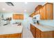 The kitchen offers a cozy space with updated appliances and ample counter space to create the perfect meal at 6425 Thicket Trl, New Port Richey, FL 34653