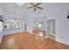 Spacious living room featuring vaulted ceilings, hardwood floors and neutral paint at 6425 Thicket Trl, New Port Richey, FL 34653