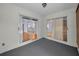 Patio with sliding glass doors and gray carpet at 6425 Thicket Trl, New Port Richey, FL 34653