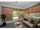 Cozy sunroom with plenty of natural light and comfortable seating at 6425 Thicket Trl, New Port Richey, FL 34653