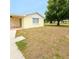 Backyard featuring a well-maintained lawn, mature trees, and privacy at 6450 Limerick Ave, New Port Richey, FL 34653