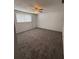 Spacious bedroom featuring neutral walls and comfortable carpet at 6450 Limerick Ave, New Port Richey, FL 34653