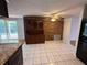 Spacious dining area featuring tile floors, ample natural light, and access to the backyard at 6450 Limerick Ave, New Port Richey, FL 34653