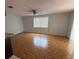 Spacious living room featuring stylish tile flooring and ample natural light at 6450 Limerick Ave, New Port Richey, FL 34653