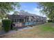 Expansive backyard with a screened-in pool, offering a private outdoor oasis perfect for relaxation and entertainment at 6490 Pine Meadows Dr, Spring Hill, FL 34606