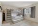 Bedroom featuring a bunk bed with trundle and storage, illuminated by natural light at 6490 Pine Meadows Dr, Spring Hill, FL 34606