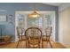 Bright breakfast nook with a bay window and cozy seating, perfect for casual dining at 6490 Pine Meadows Dr, Spring Hill, FL 34606