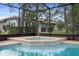 Close-up of the inviting hot tub and refreshing pool combo, perfect for relaxation and entertainment at 6490 Pine Meadows Dr, Spring Hill, FL 34606