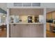 Inviting eat-in kitchen features a breakfast bar area with light wooden cabinets at 6490 Pine Meadows Dr, Spring Hill, FL 34606