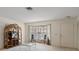 Bright living room featuring a large window, comfortable seating, and natural light at 6490 Pine Meadows Dr, Spring Hill, FL 34606