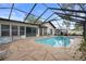 Inviting screened-in pool and spa area, ideal for outdoor enjoyment and relaxation year-round at 6490 Pine Meadows Dr, Spring Hill, FL 34606
