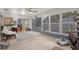 Bright sunroom with lots of natural light through the large windows and sliding glass door at 6490 Pine Meadows Dr, Spring Hill, FL 34606
