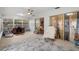 Bright sunroom with lots of natural light through the large windows and sliding glass door at 6490 Pine Meadows Dr, Spring Hill, FL 34606