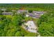 Aerial view of community buildings with shared pool and recreational facilities surrounded by lush greenery, offering a relaxing atmosphere at 6583 River Run Blvd # 21005, Weeki Wachee, FL 34607
