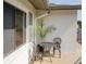 Cozy balcony featuring decorative iron chairs, a small table, and a potted plant, perfect for relaxing and enjoying the outdoor ambiance at 6583 River Run Blvd # 21005, Weeki Wachee, FL 34607