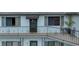 Charming balcony with decorative iron railings, cozy seating, and a view of the manicured grounds, creating a relaxing outdoor space at 6583 River Run Blvd # 21005, Weeki Wachee, FL 34607