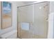 Bathroom featuring tile shower with glass doors and neutral tile at 6583 River Run Blvd # 21005, Weeki Wachee, FL 34607