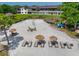 Aerial view of the sandy beach area with lounge chairs and umbrellas at 6583 River Run Blvd # 21005, Weeki Wachee, FL 34607