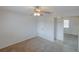 Spacious bedroom featuring plush carpet, a ceiling fan, and a mirrored closet at 6583 River Run Blvd # 21005, Weeki Wachee, FL 34607