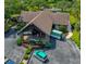 Exterior view of the building entrance, complemented by lush landscaping and ample parking at 6583 River Run Blvd # 21005, Weeki Wachee, FL 34607