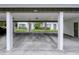 View of carport with parking spaces, and building's address at 6583 River Run Blvd # 21005, Weeki Wachee, FL 34607