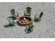 View of sandy beach firepit with Adirondack chairs in a cozy setting at 6583 River Run Blvd # 21005, Weeki Wachee, FL 34607