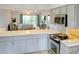 Bright kitchen with stainless steel appliances, and light gray cabinetry with an open layout into the living area at 6583 River Run Blvd # 21005, Weeki Wachee, FL 34607
