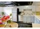 Bright kitchen features stainless steel appliances, tile backsplash, and ample counter space at 6583 River Run Blvd # 21005, Weeki Wachee, FL 34607