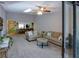 View from the balcony into the comfortable open floor plan with lots of natural light at 6583 River Run Blvd # 21005, Weeki Wachee, FL 34607