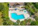 Aerial view of large community pool with jacuzzi, seating, and lounging areas at 6583 River Run Blvd # 21005, Weeki Wachee, FL 34607