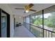 Screened porch with ceiling fan and relaxing outdoor space at 6583 River Run Blvd # 21005, Weeki Wachee, FL 34607