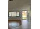 Inviting living room featuring wood and tiled floors and ample natural light at 7331 Sandalwood Dr, Port Richey, FL 34668
