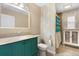 Charming bathroom with a unique vanity, decorative wall art, and well-lit mirror at 7464 Acorn Cir, Spring Hill, FL 34606