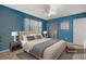Staged bedroom features a plush bed, side tables, and a ceiling fan for a cozy feel at 7464 Acorn Cir, Spring Hill, FL 34606
