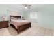 Comfortable bedroom featuring tile flooring, natural light, and ceiling fan at 7464 Acorn Cir, Spring Hill, FL 34606
