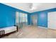 Bedroom with light-filled window, tile floor, and a ceiling fan at 7464 Acorn Cir, Spring Hill, FL 34606