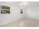 Clean bedroom with tile floors and bright natural light at 7464 Acorn Cir, Spring Hill, FL 34606