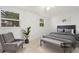 Relaxing bedroom with cozy seating, stylish furniture, and serene natural light at 7464 Acorn Cir, Spring Hill, FL 34606