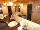Bathroom with dual sinks, decorative lighting, and a large mirror reflecting the vanity at 7632 Lake Forest Cir, Port Richey, FL 34668