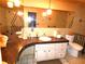 Bathroom with a unique countertop, decorative lighting, and tiled walls at 7632 Lake Forest Cir, Port Richey, FL 34668