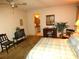 Bedroom featuring a bed, vintage furniture, and natural light from a window at 7632 Lake Forest Cir, Port Richey, FL 34668