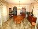 Traditional dining room features a chandelier, wood furniture, and unique decor at 7632 Lake Forest Cir, Port Richey, FL 34668